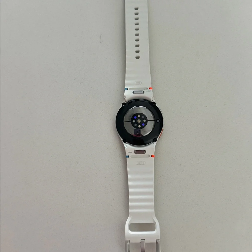 Samsung Smartwatch with White Strap and Black Face